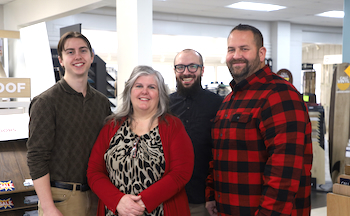 Carpet Master team helping a customer choose flooring